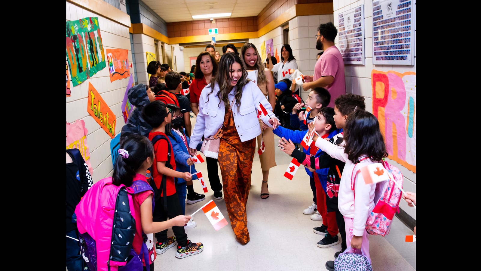 Ms. Fabian and her family get a warm reception from Stanley Knowles students.